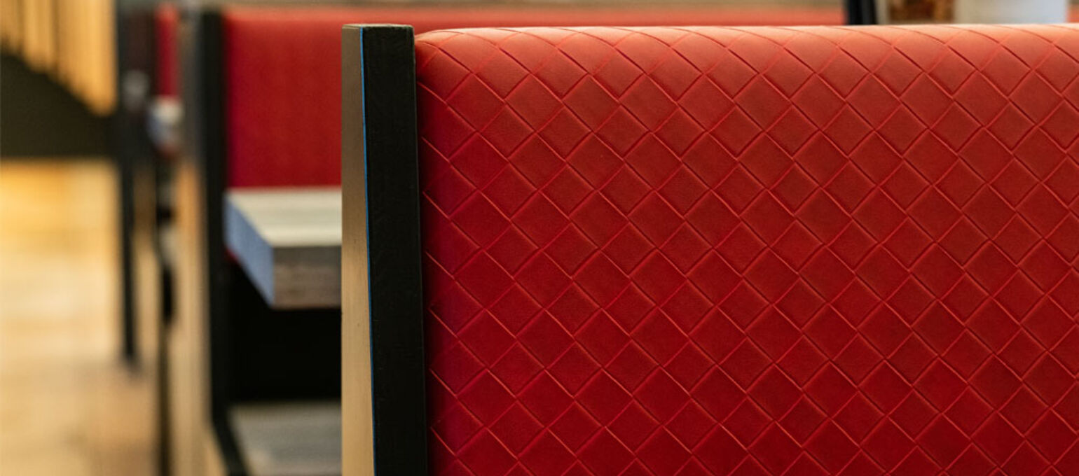 Skai® artificial leather in red and violet for the catering trade