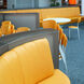 Artificial leather from skai<sup>®</sup> in yellow and orange for upholstered furniture
